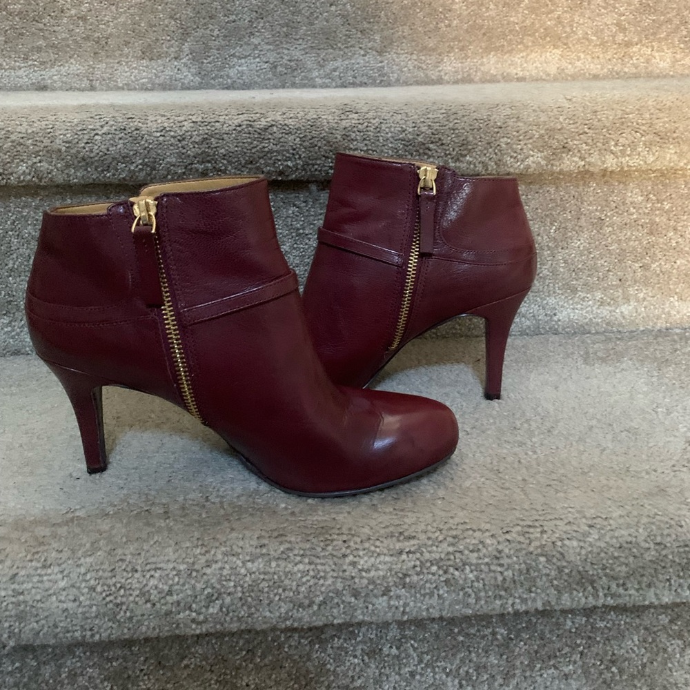 Nine West burgundy booties with gold buckle and gold zippers.  Size 7 1/2.